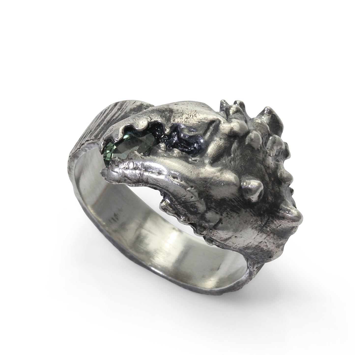 A blackened silver ring shaped like a crab claw holding a green sapphire gemstone. Perfect for a mans Christmas present. A nice piece of jewellery for a fashion conscious man.