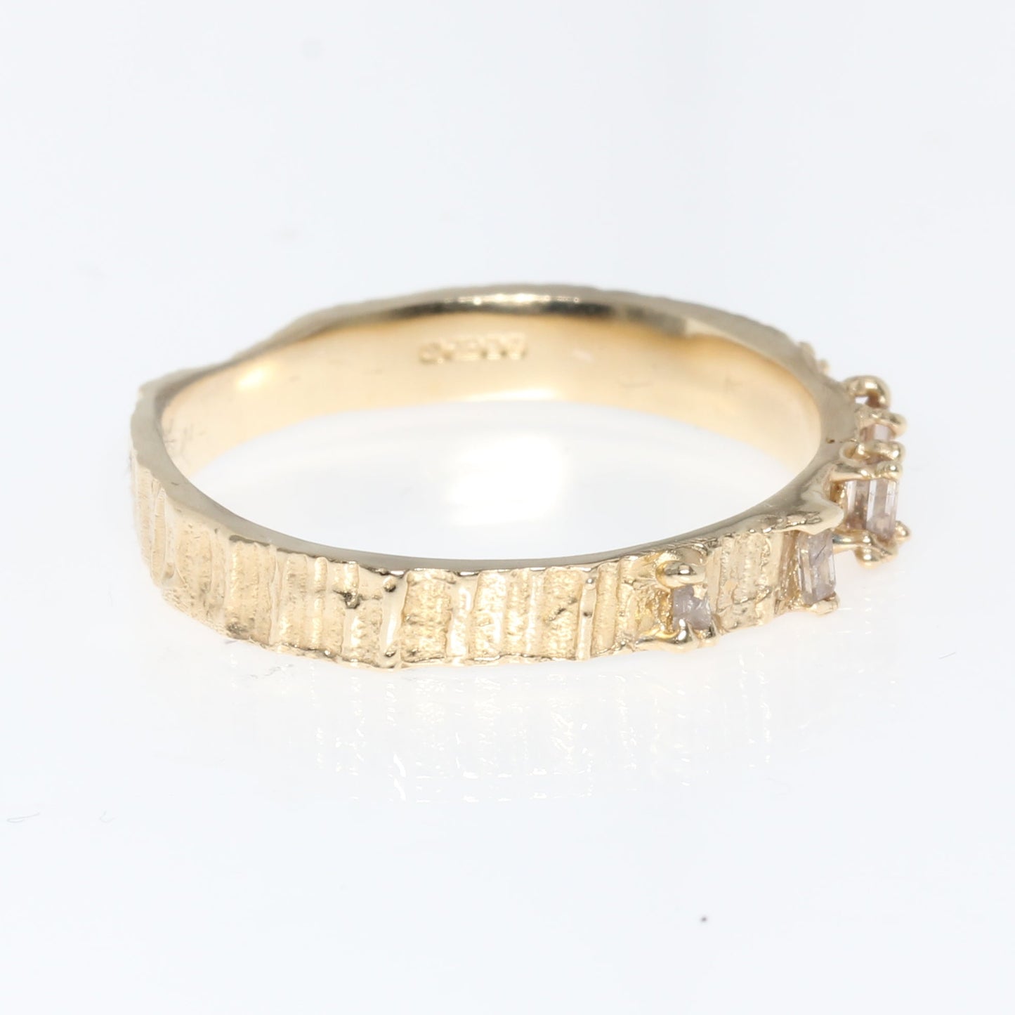 Gold ring on a white background