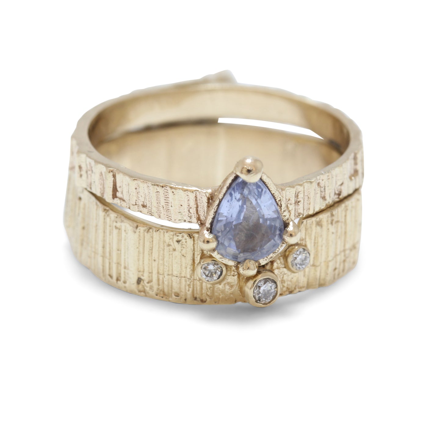 fitted engagement ring and wedding band with pear sapphire and diamonds