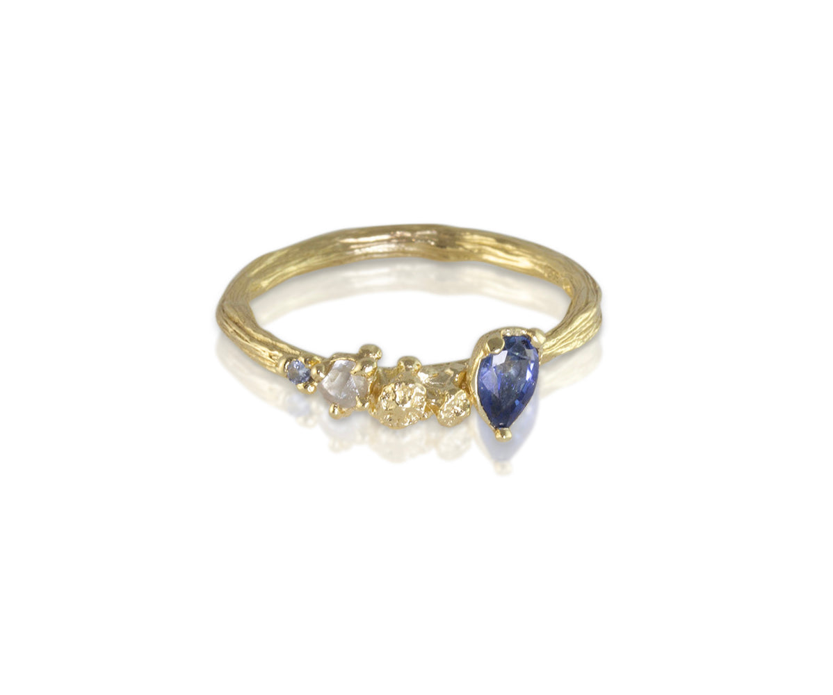 Gold ring with raw diamond and nice blue sapphire for engagement ring.
