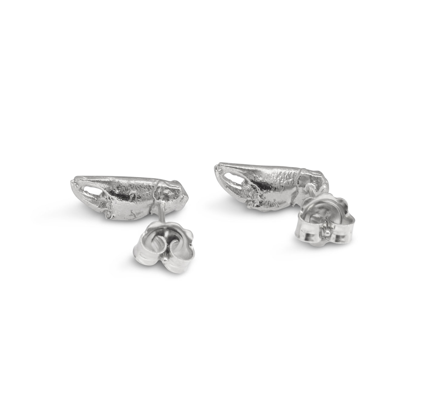 A pair of silver stud earrings cast from tiny crab claws into solid silver showing back stud view