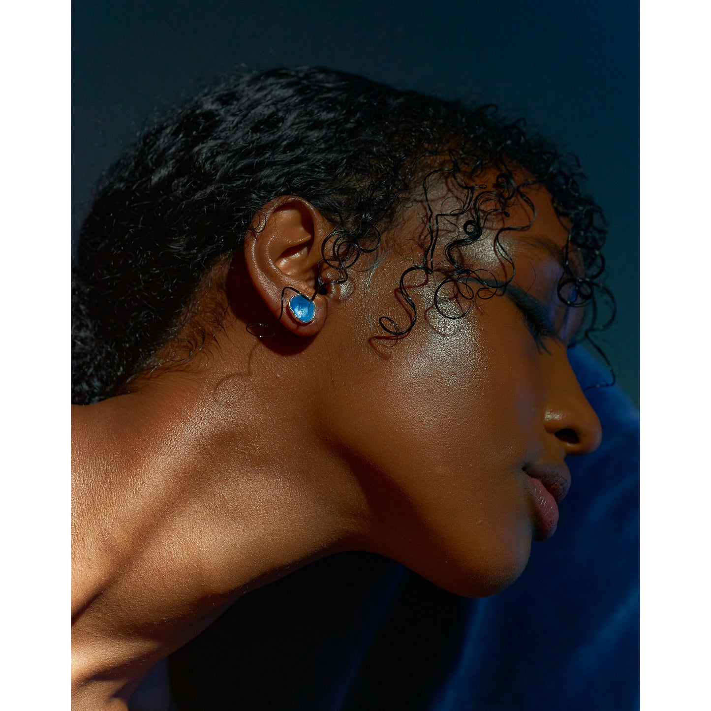 Model wearing acorn enamel studs