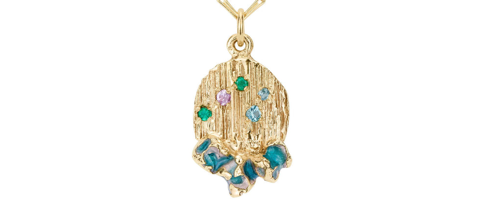 Zoomed in picture of a gold pendant with multi colour sapphires and enamel. Handmade with lots of texture. Made in Bristol by Irish jeweller Eily O Connell using recycled gold. 