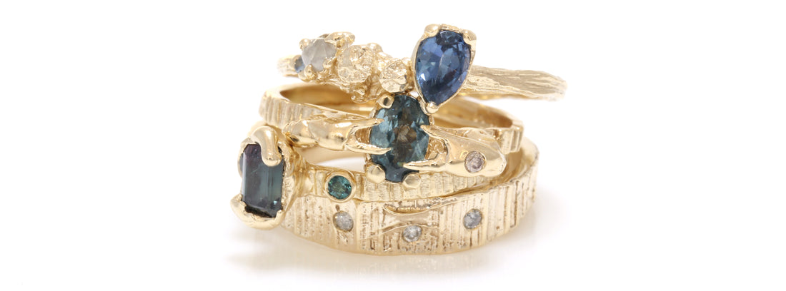 Engagement ring stacking rings with crab claws and blue sapphires and raw diamonds