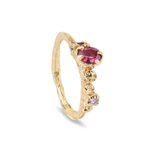 Handmade gold ring with twig band and berry clusters. A pink sapphire is organically set and there is pink enamel to one side also. A tiny champagne diamond is also in the ring. One of a kind ring.