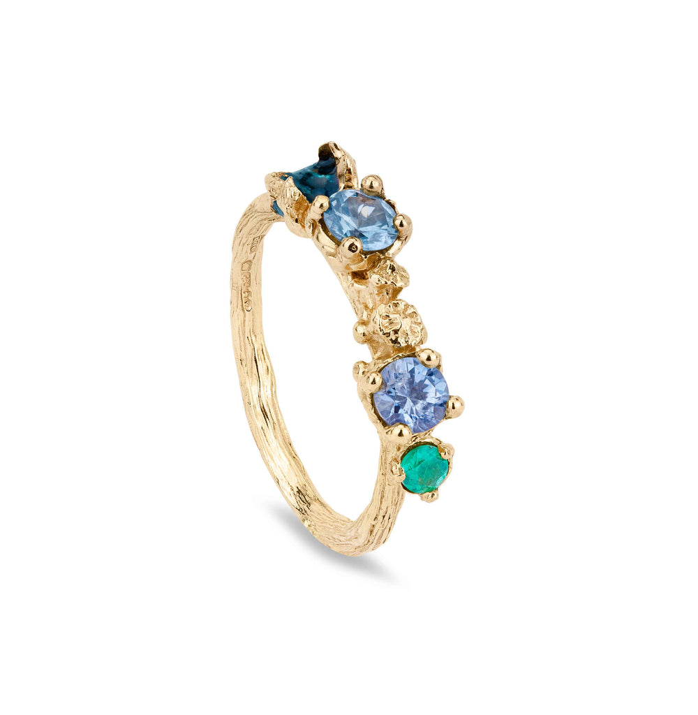 Gold engagement ring cast from a twig with sapphires and green ebnamel and also a green emerald 