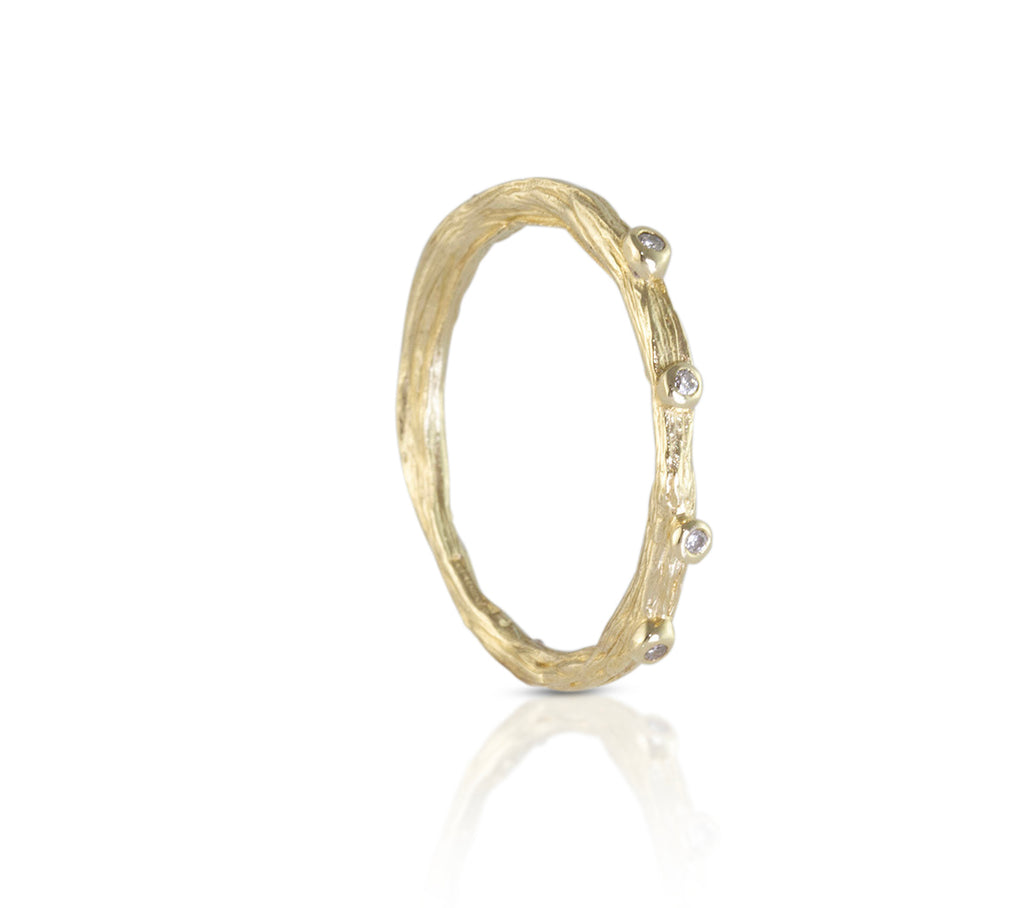 Alternative wedding band organic cast from a twig with diamonds. 