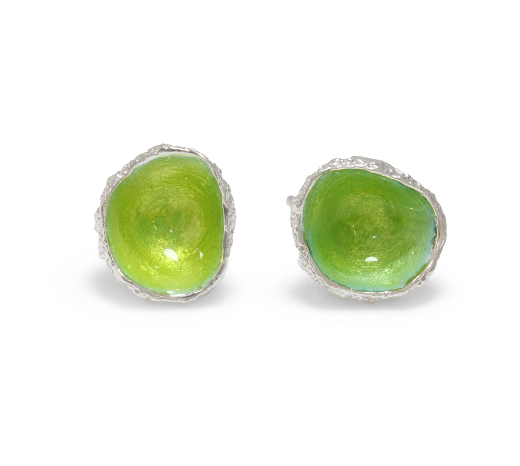 Earrings cast from little acorns into silver. Enamelled with vivid lime green enamel like glow worms
