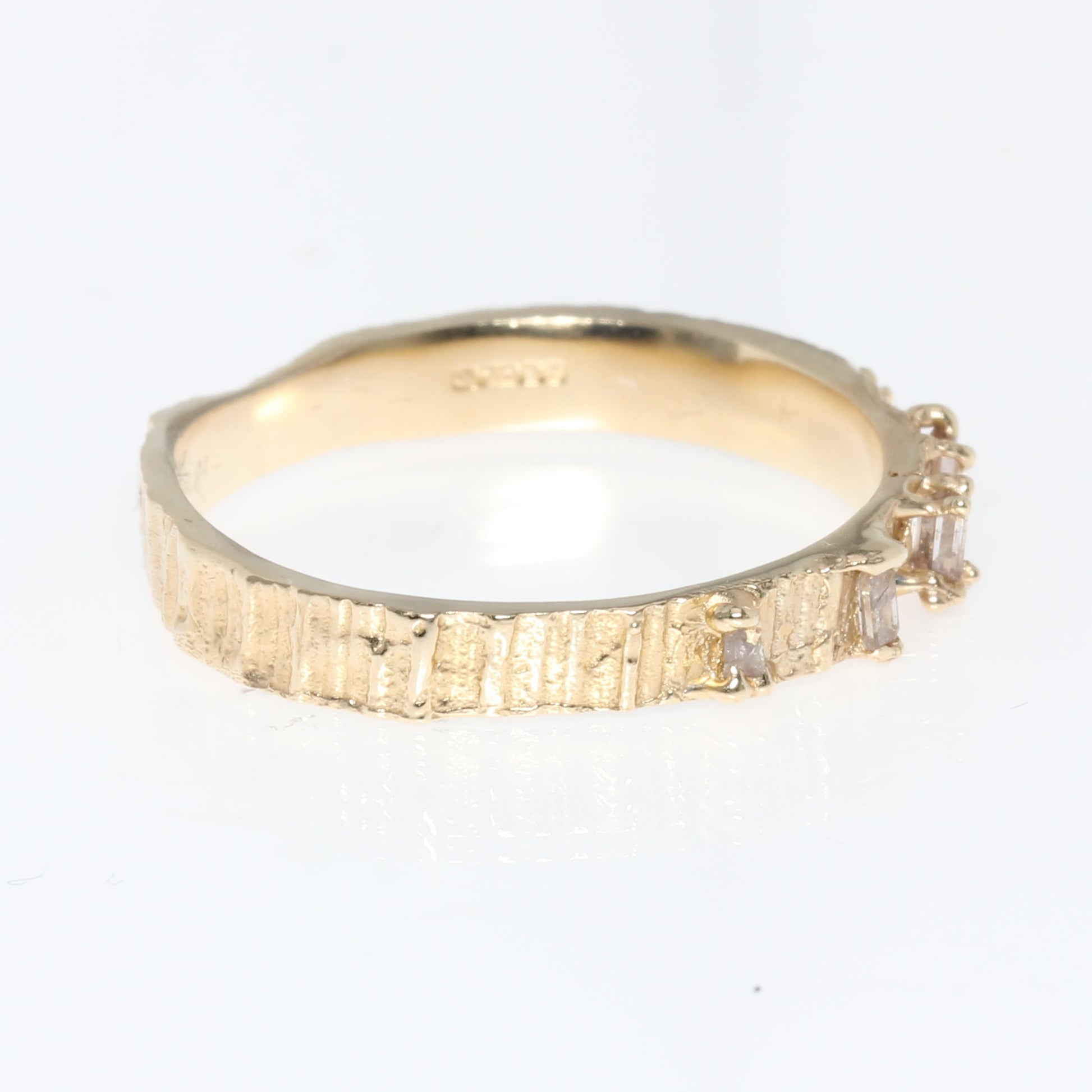 Gold ring on a white background