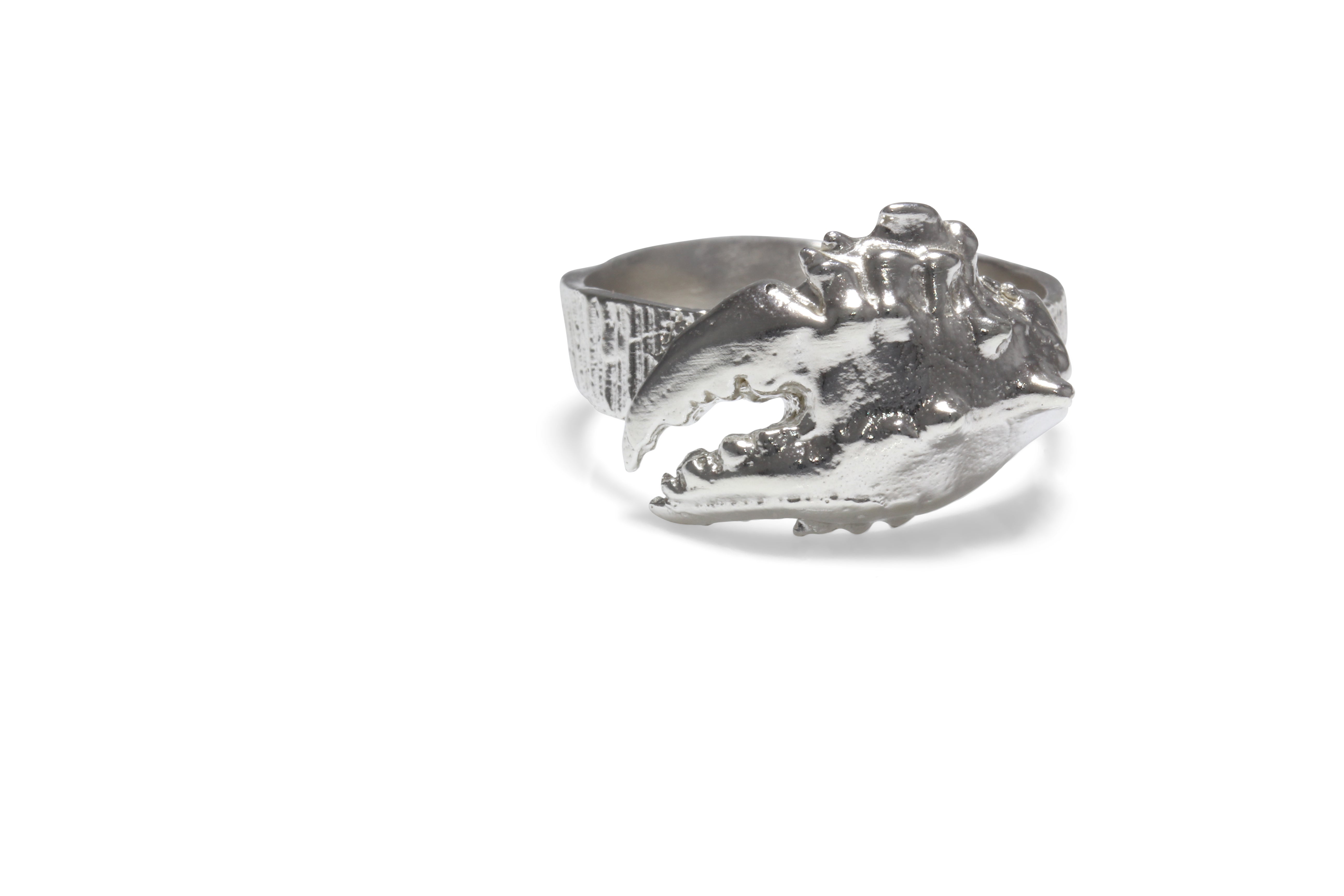 Front view of statement crab claw ring in silver