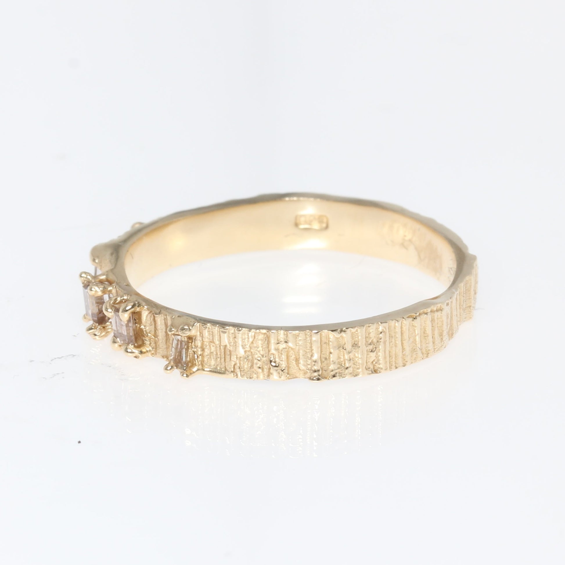 Gold ring on a white background