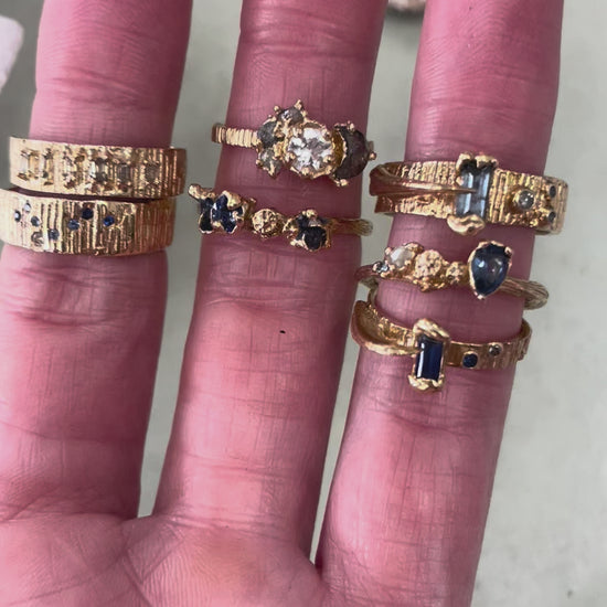 Alternative bride and groom gold textured rings beng worn