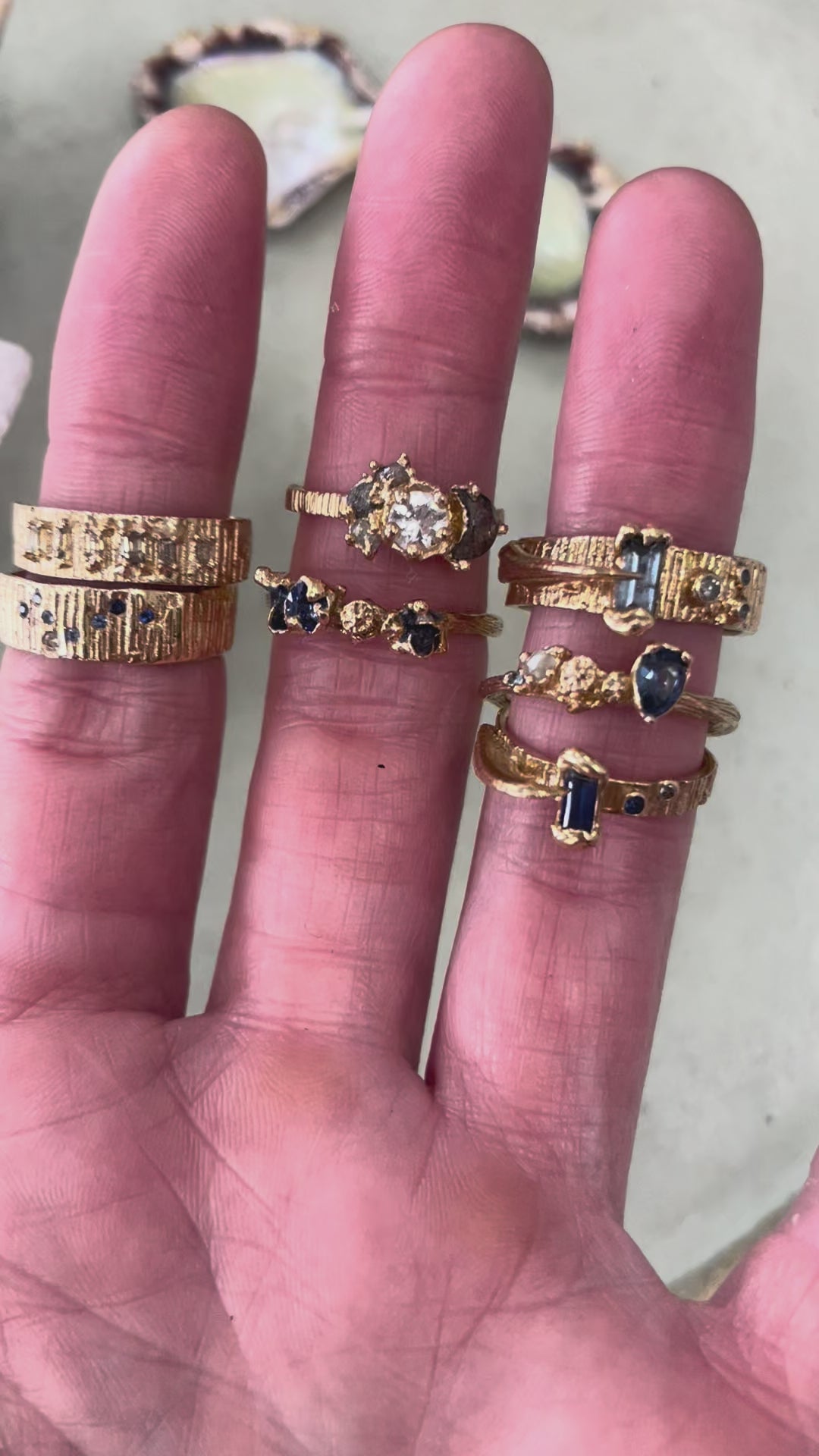 Alternative bride and groom gold textured rings beng worn