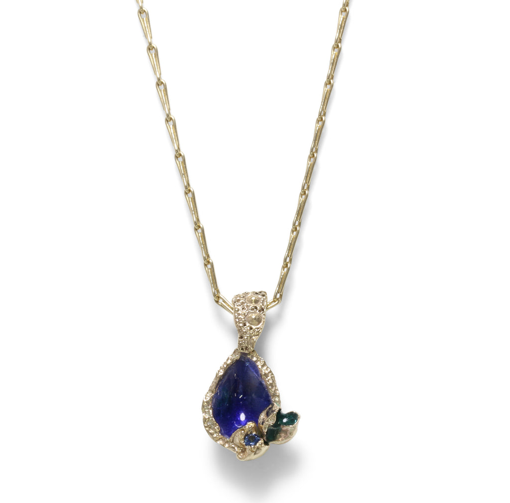 Gold necklace with enamel in blue that looks like gemstone. with tiny sapphire set to the side also. 