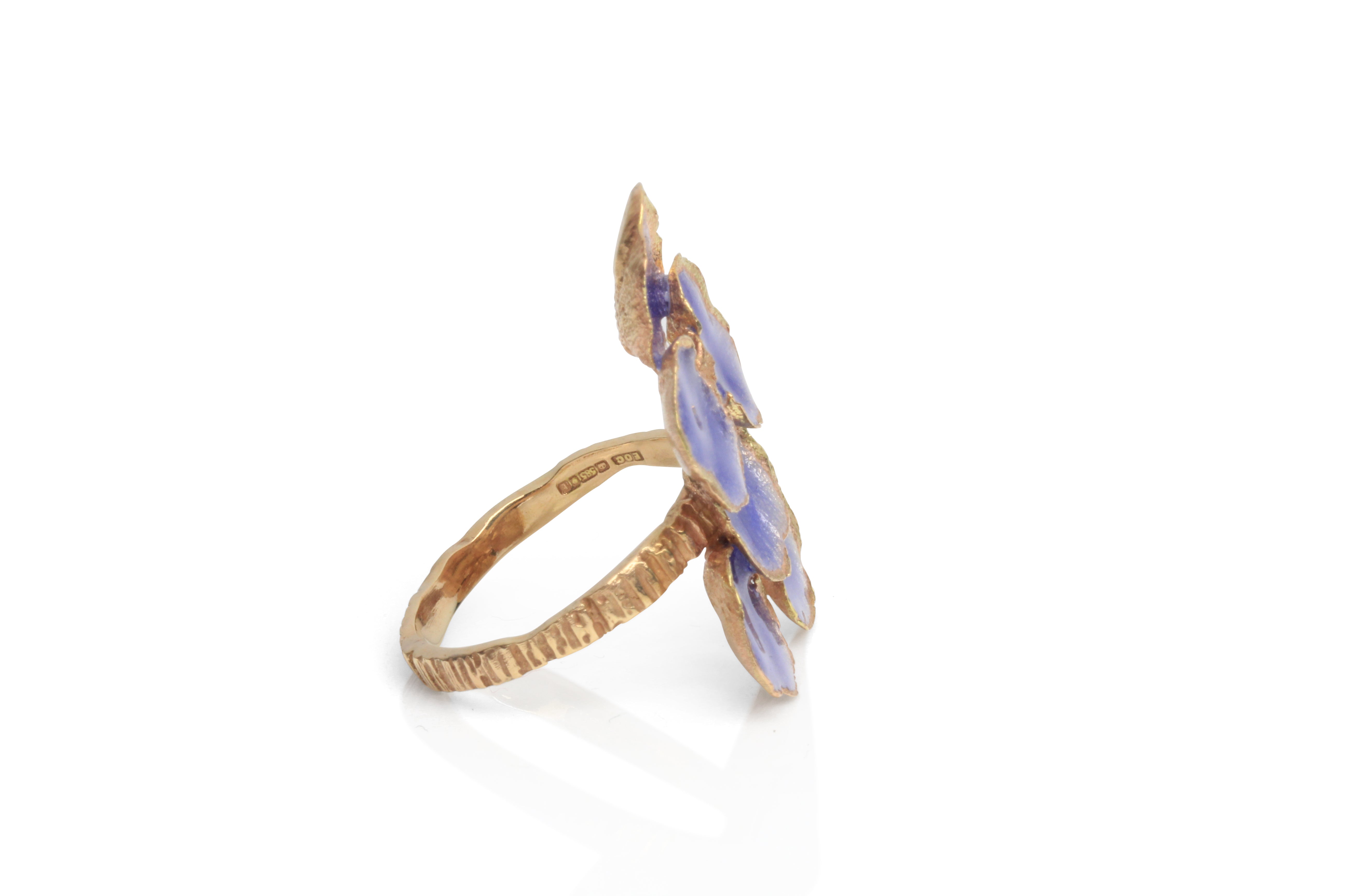 View showing hallmark of handmade ring by Eily O Connell with purple enamel.
